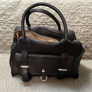 Black bag with concealed carry pocket